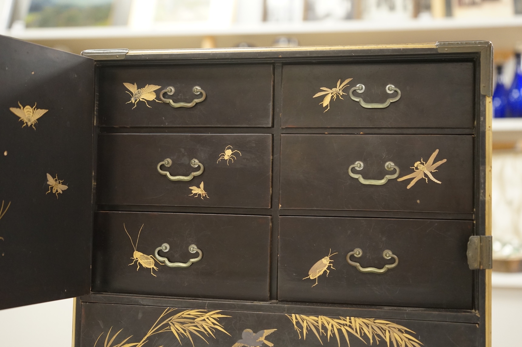 A Chinese export lacquered table cabinet with fitted interior, lacking door, 32cm high